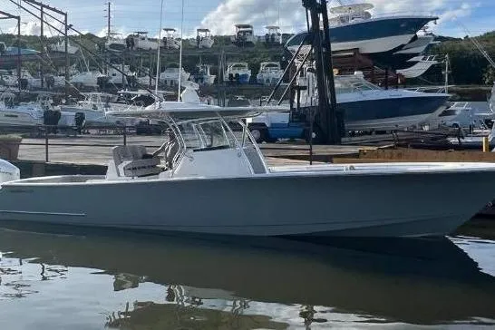 The Image of 2023 Valhalla Boatworks V-37 in marina, surrounded by other boats and calm water. - 0