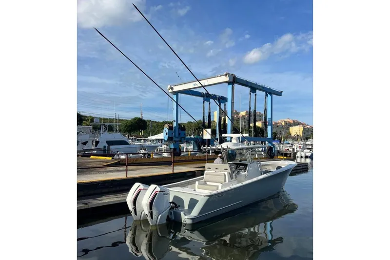 Slide: The Image of 2023 Valhalla Boatworks V-37 docked at marina, featuring dual outboard engines. - 3