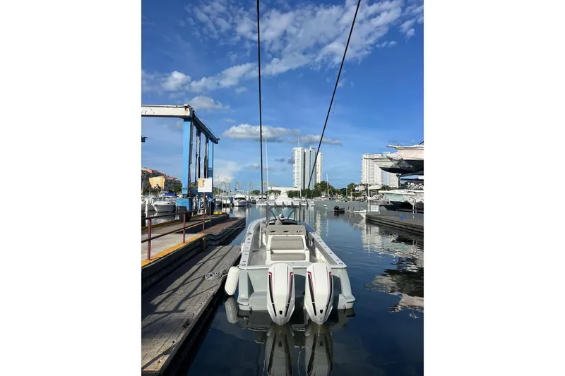 Slide: The Image of 2023 Valhalla Boatworks V-37 docked in a marina under a clear blue sky. - 4