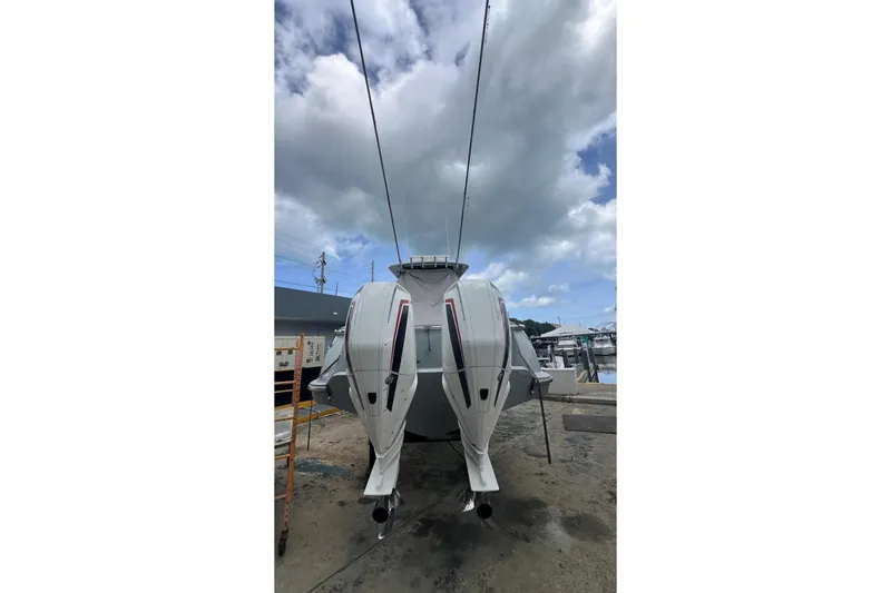 Slide: The Image of 2023 Valhalla Boatworks V-37 with dual outboard engines at a marina. - 5