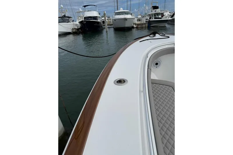 Slide: The Image of 2023 Valhalla Boatworks V-37 docked, showcasing sleek design and luxurious detailing. - 7