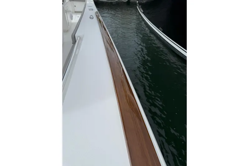 Slide: The Image of 2023 Valhalla Boatworks V-37, sleek deck view with polished wood finish. - 8