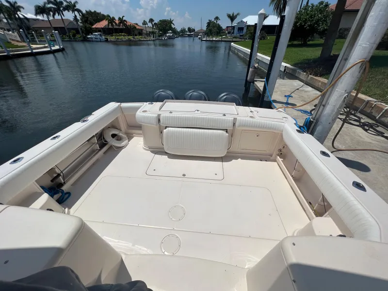 Slide: The Image of 2006 Grady-White 360 Express boat docked in a scenic canal setting. - 3
