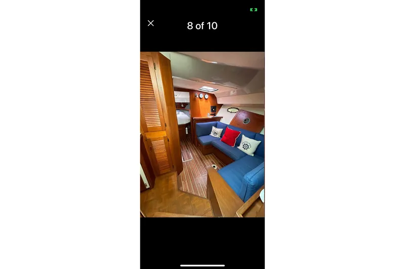 Slide: The Image of Interior of a 1987 Tiara 3600 yacht with blue seating and nautical decor. - 12