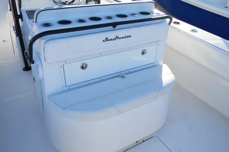 Slide: The Image of 2015 SeaHunter 35 Tournament boat interior with seating and storage compartments. - 13