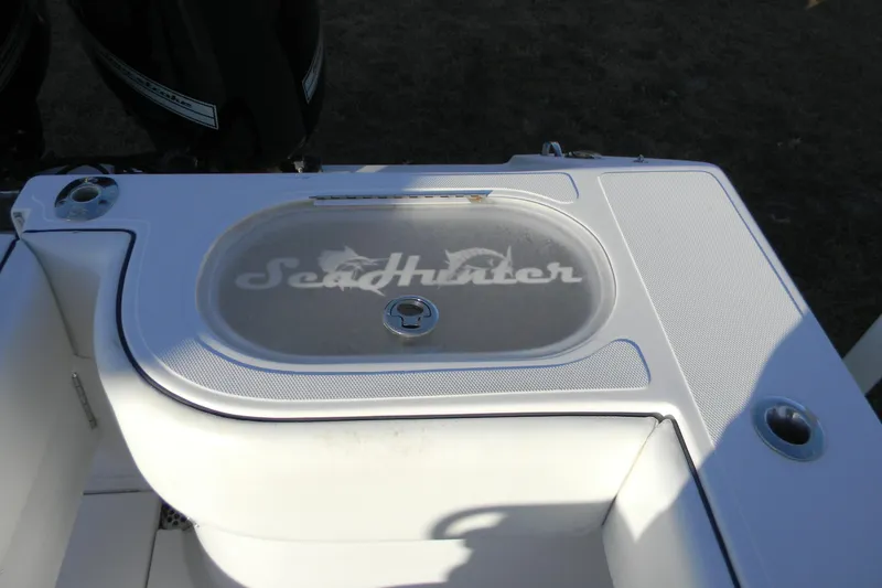 Slide: The Image of 2015 SeaHunter 35 Tournament boat deck with logo and storage compartment. - 14
