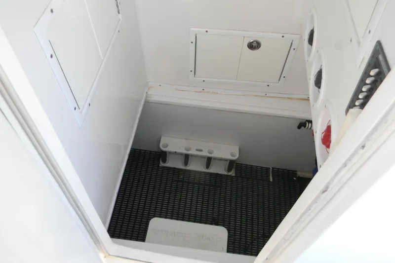 Slide: The Image of 2015 SeaHunter 35 Tournament boat interior storage compartment with utility access. - 20