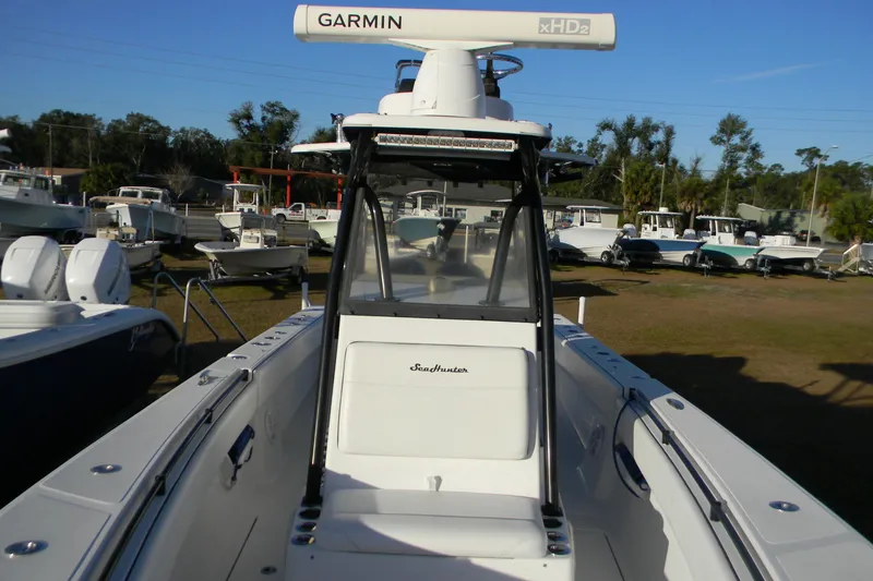 Slide: The Image of 2015 SeaHunter 35 Tournament boat with Garmin radar, parked among other boats. - 4
