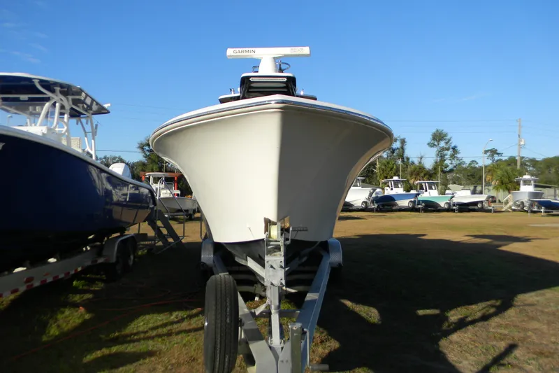 Slide: The Image of 2015 SeaHunter 35 Tournament boat on trailer, displayed outdoors under clear blue sky. - 6