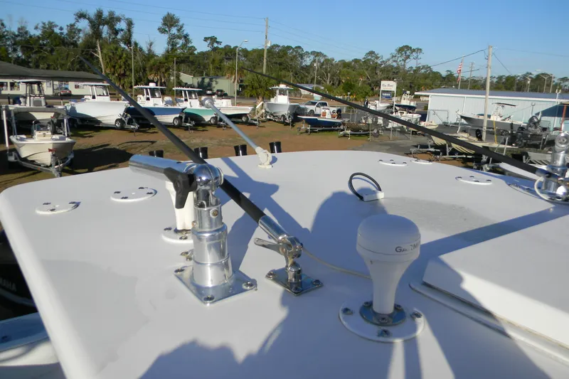 Slide: The Image of 2015 SeaHunter 35 Tournament boat with antennas and equipment on deck, surrounded by other boats. - 9