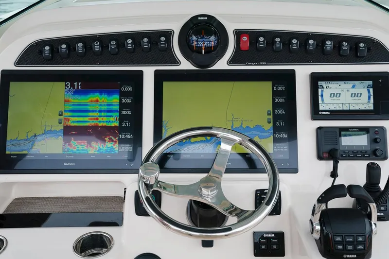 Slide: The Image of Manufacturer Provided Image: Grady-White Canyon 336 2020 boat dashboard with navigation and control systems. - 4