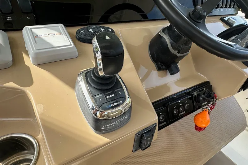 Slide: The Image of Control panel of 2019 Sailfish 360 CC boat with joystick and steering wheel. - 22