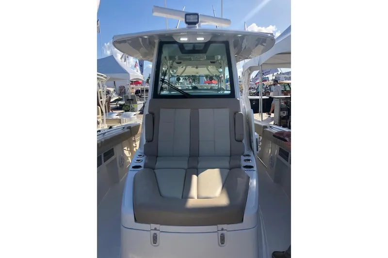 Slide: The Image of 2019 Sailfish 360 CC boat interior with cushioned seating and modern design. - 8