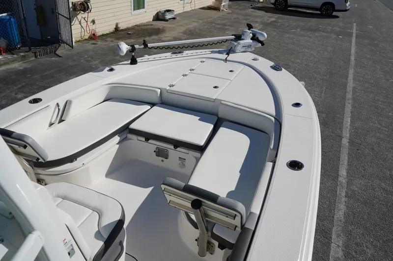 Slide: The Image of 2023 Robalo 246 Cayman boat interior with seating and storage compartments. - 7