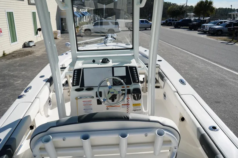 Slide: The Image of 2023 Robalo 246 Cayman boat interior with steering console and seating. - 8