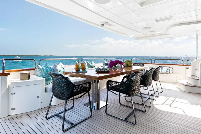 Slide: The Image of Luxurious aft deck dining area on 2012 Azimut Grande 32M yacht with ocean view. - 15