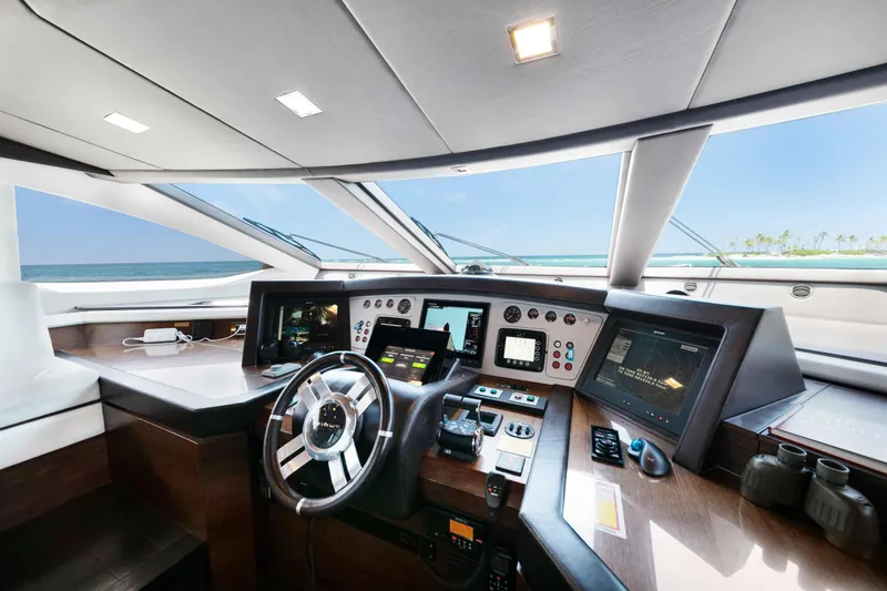 Slide: The Image of Cockpit of 2012 Azimut Grande 32M yacht with modern navigation equipment and ocean view. - 26