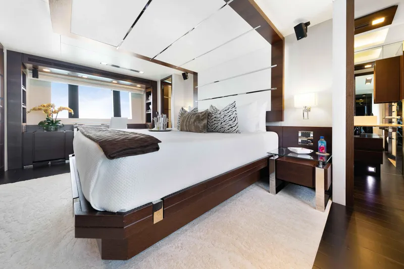 Slide: The Image of Luxurious Master bedroom interior on 2012 Azimut Grande 32M yacht, featuring modern design and elegant furnishings. - 32