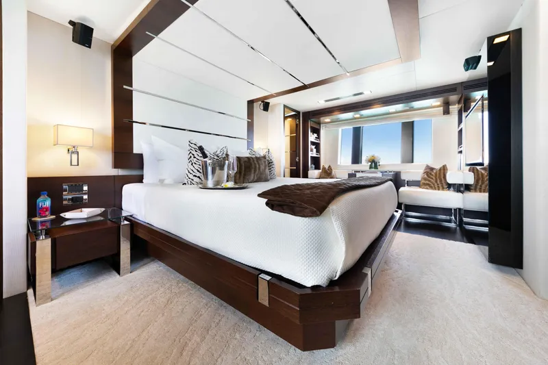 Slide: The Image of Luxurious Master bedroom interior on 2012 Azimut Grande 32M yacht, featuring modern design and elegant furnishings. - 33