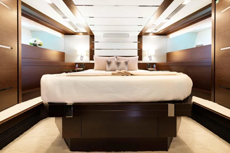 Slide: The Image of Luxurious lower VIP cabin on 2012 Azimut Grande 32M yacht, featuring elegant wood finishes. - 42