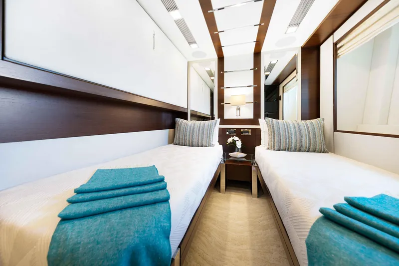 Slide: The Image of Luxurious interior of 2012 Azimut Grande 32M yacht with twin beds, pullman, sleeping three in total, and elegant decor. - 45