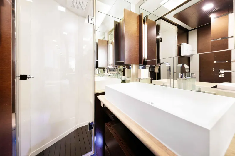 Slide: The Image of Luxurious Twin bathroom interior of 2012 Azimut Grande 32M yacht with modern fixtures. Each Cabin has mirror bathrooms. - 46