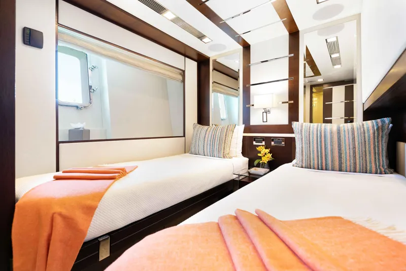 Slide: The Image of Luxurious interior of 2012 Azimut Grande 32M yacht with twin beds, pullman, sleeping three in total, and elegant decor. - 47