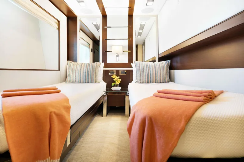 Slide: The Image of Luxurious interior of 2012 Azimut Grande 32M yacht with twin beds, pullman, sleeping three in total, and elegant decor. - 48