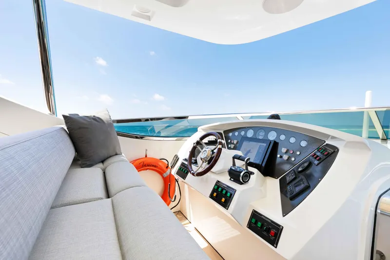 Slide: The Image of Luxurious Azimut Grande 32M yacht helm with modern controls and plush seating, 2012 model. - 49