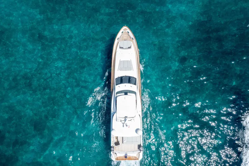 Slide: The Image of Aerial view of 2012 Azimut Grande 32M yacht cruising in clear blue waters. - 5