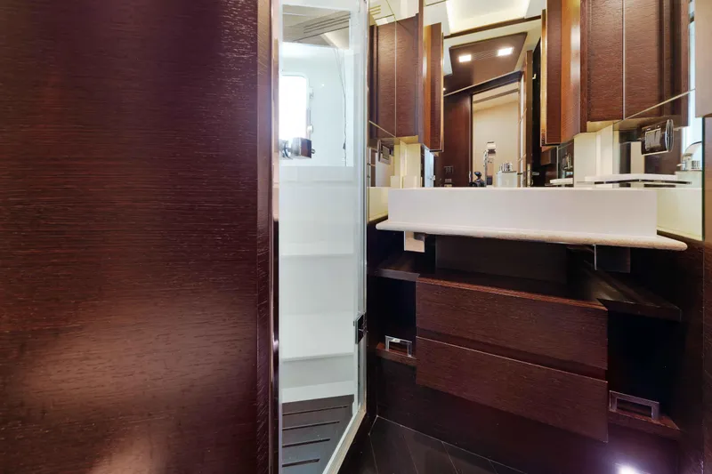 Slide: The Image of Luxurious Lower VIP bathroom interior on 2012 Azimut Grande 32M yacht, featuring modern design and dark wood finishes. - 54