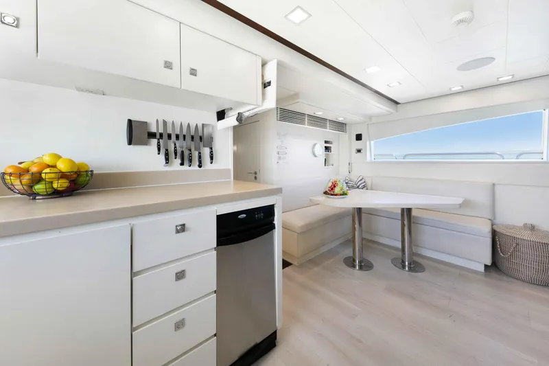 Slide: The Image of Luxurious kitchen and dining area on 2012 Azimut Grande 32M yacht, featuring modern design and amenities. - 58