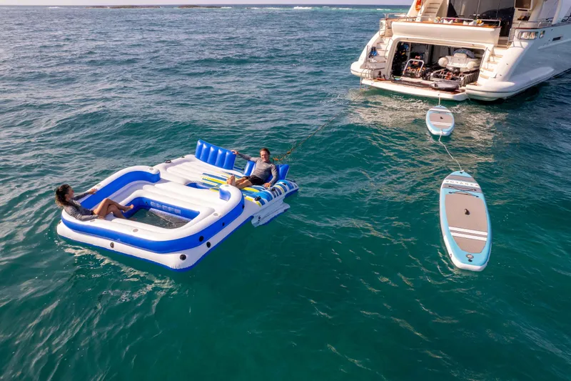 Slide: The Image of Azimut Grande 32M yacht, 2012 model, anchored in clear blue ocean with water toys. - 6