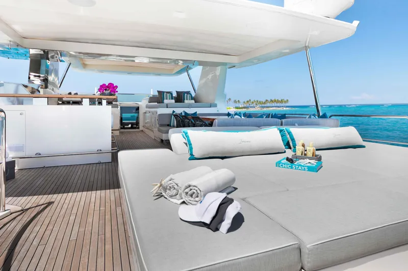 Slide: The Image of Luxurious Azimut Grande 32M yacht deck with sun loungers, ocean view, and elegant decor. - 67