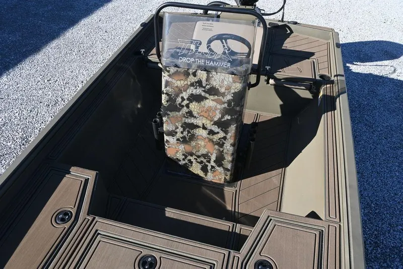 Slide: The Image of 2026 Thor 1900 Lake Hammer Center Console Elite boat interior with camouflage console design. - 11