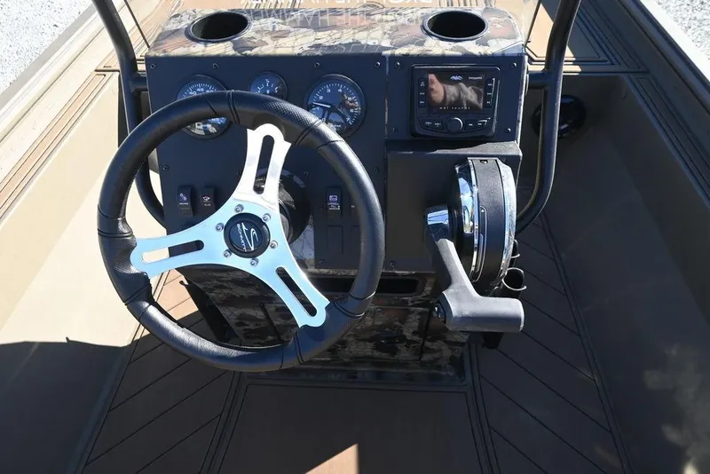 Slide: The Image of 2026 Thor 1900 Lake Hammer Center Console Elite dashboard with steering wheel and controls. - 9