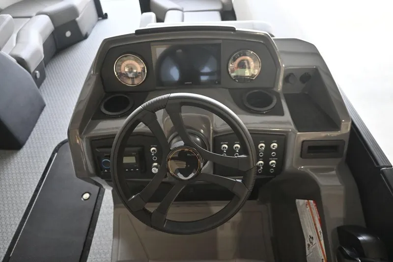 Slide: The Image of Steering console of 2026 Evotti 523CS boat with modern controls and dashboard. - 19