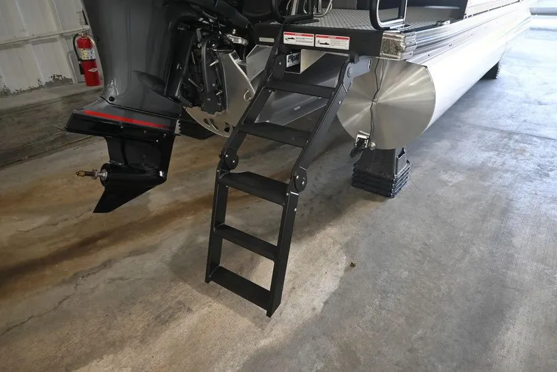 Slide: The Image of 2026 Evotti 523CS boat with ladder and motor in a garage setting. - 3