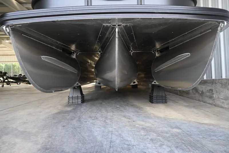Slide: The Image of Underneath view of 2026 Evotti 523CS pontoon boat in storage facility. - 8