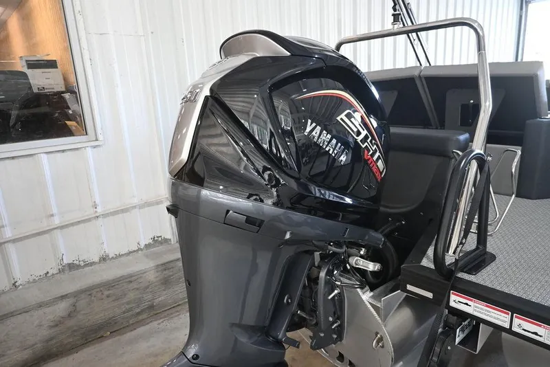 Slide: The Image of 2026 Evotti 523CS boat with Yamaha outboard motor in a showroom. - 9