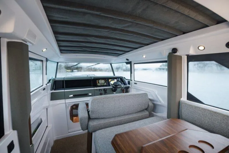 Slide: The Image of Interior of 2026 Axopar 38 Cross Cabin, featuring modern design and comfortable seating. - 13