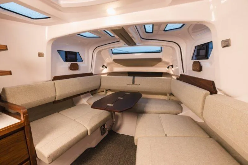 Slide: The Image of Luxurious interior of 2026 Axopar 38 Cross Cabin with modern seating and skylights. - 23