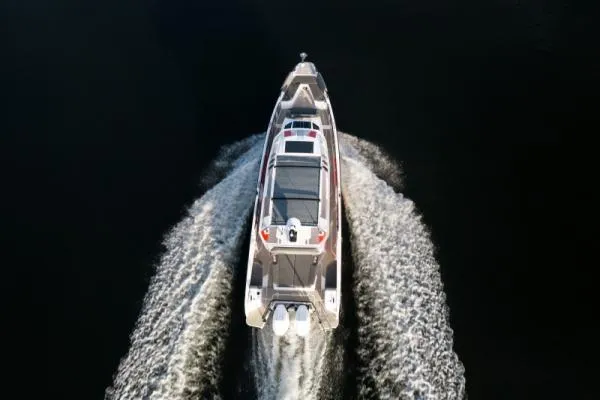 Slide: The Image of Aerial view of 2026 Axopar 38 Cross Cabin boat cruising on water. - 6