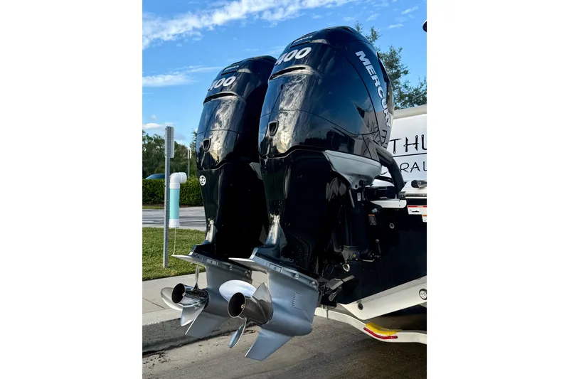 Slide: The Image of Twin Mercury outboard engines on a 2022 Sportsman Open 322 Center Console boat. - 27
