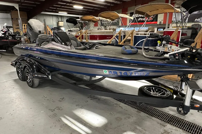 Slide: The Image of 2016 Skeeter FX20 Limited Edition bass boat in showroom, side view. - 3
