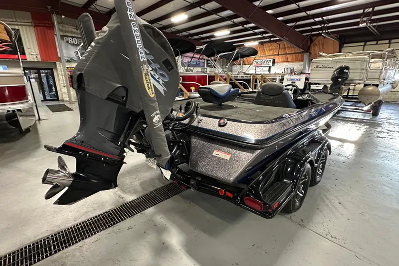 Slide: The Image of 2016 Skeeter FX20 Limited Edition boat in showroom, featuring powerful outboard motor. - 5