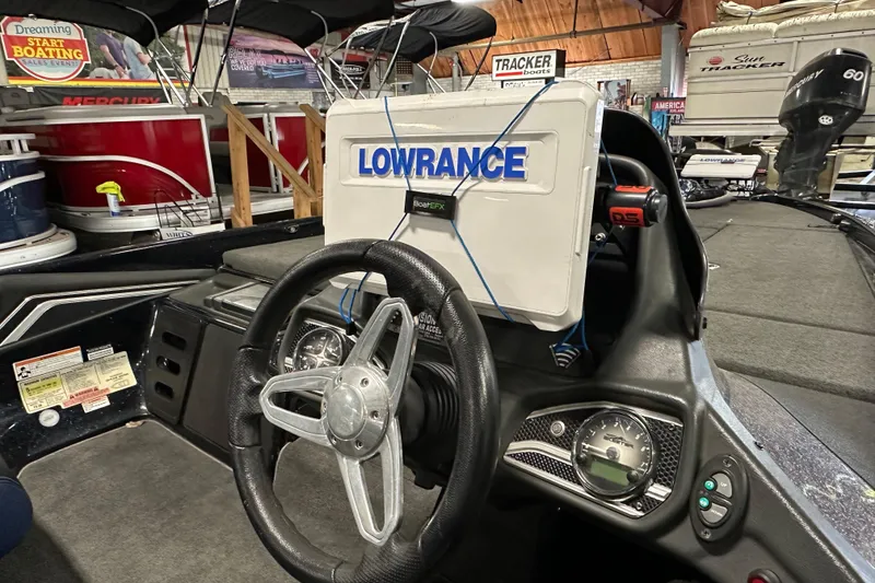 Slide: The Image of 2016 Skeeter FX20 Limited Edition boat dashboard with Lowrance electronics display. - 8