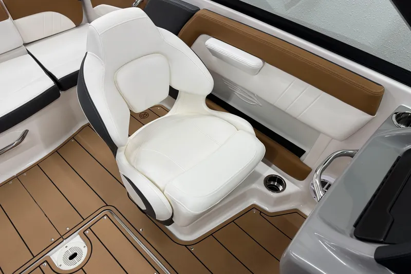 Slide: The Image of 2026 Chaparral 21 SSi boat interior with white seating and brown accents. - 18