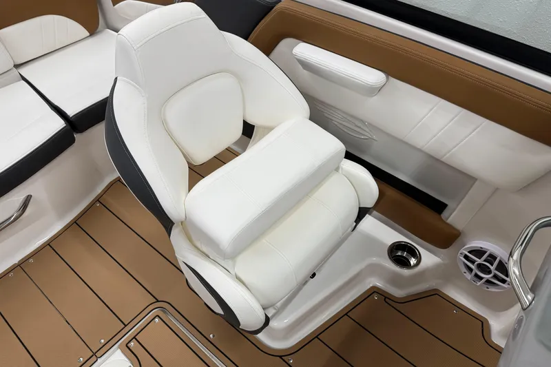 Slide: The Image of 2026 Chaparral 21 SSi boat interior with white and brown seating and flooring. - 19