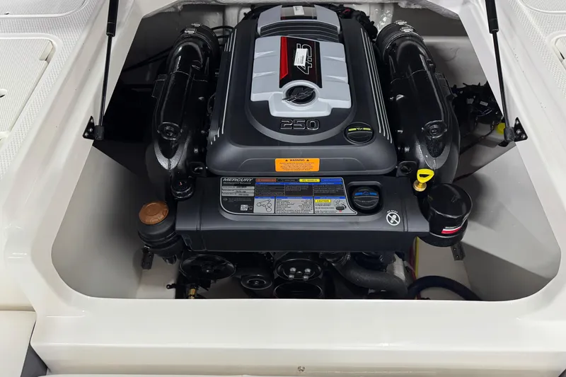 Slide: The Image of Engine compartment of 2026 Chaparral 21 SSi boat, featuring a Mercury 250 engine. - 26